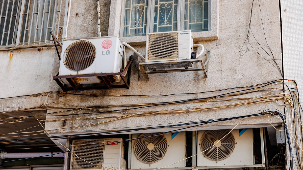 Air conditioner outdoor units on the wall of a building